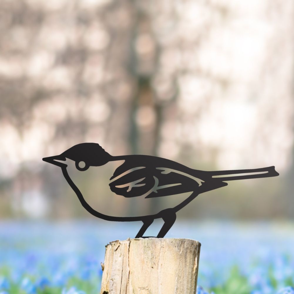 Steel Blackcap Fence Topper In Black In A Wildflower Setting