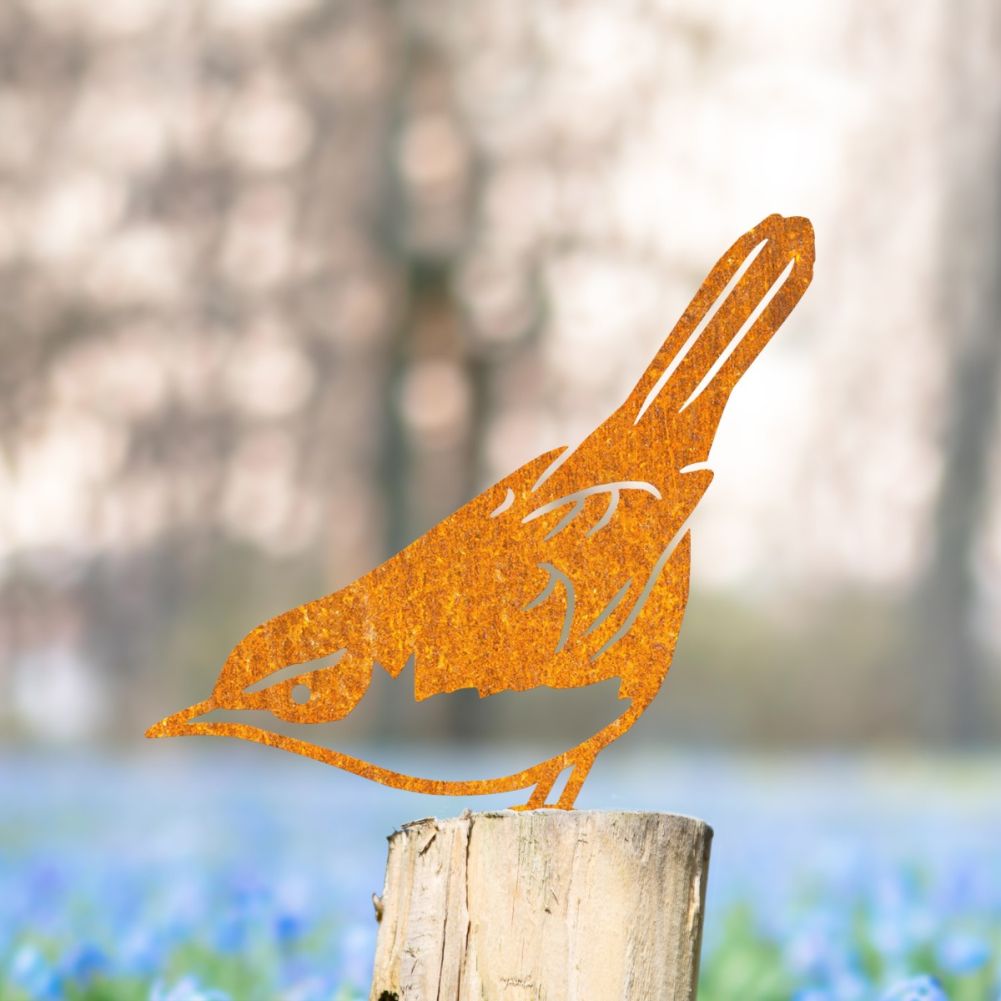 Steel Cettis Warbler Fence Topper In Rustic In A Wildflower Setting