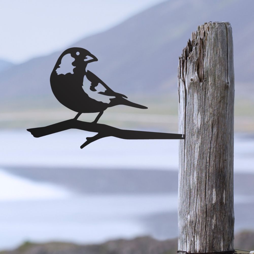Steel Greenfinch Tree Spike In Black In A Mountain Setting