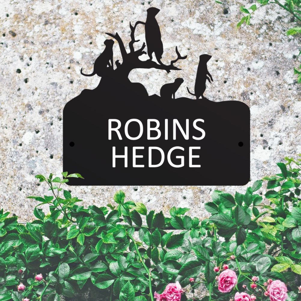 Steel Meerkat House Sign On A Leafy Wall