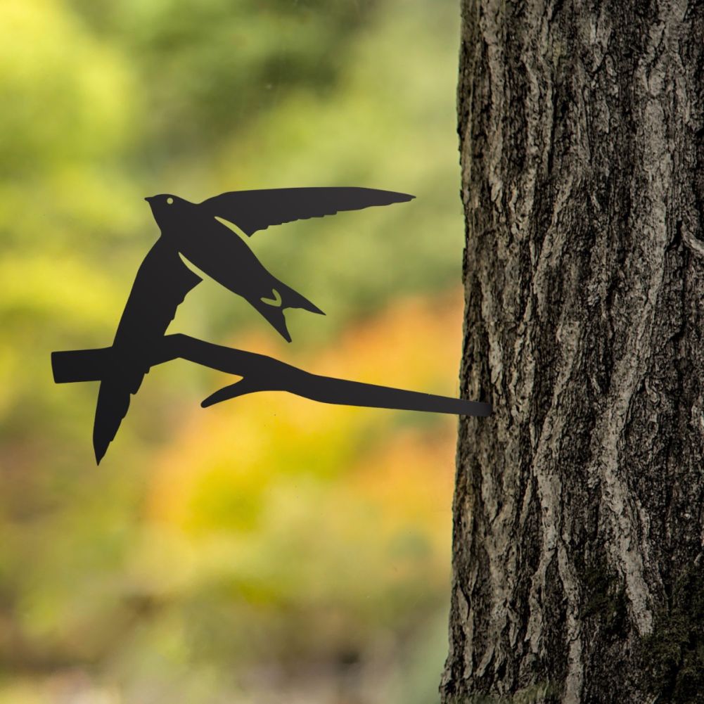 Steel Swift Tree Spike In Black In A Forest Setting