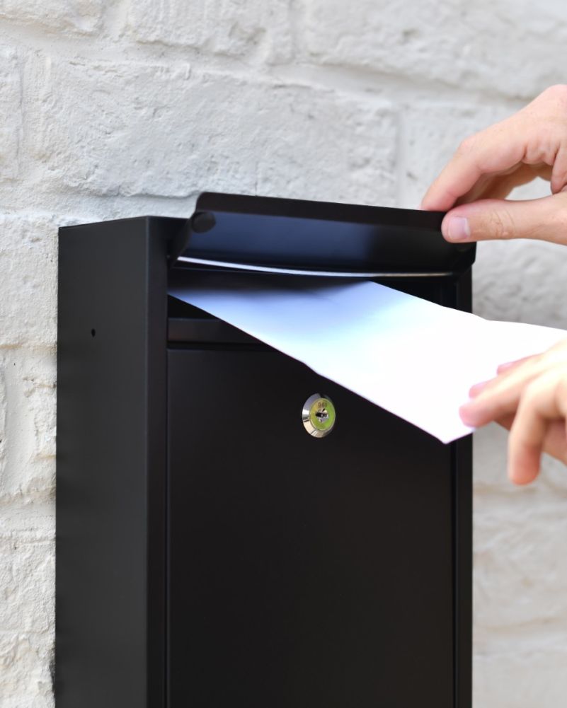 Putting Lettings Into The Steel Wall Mounted Contemporary Post Box In Black