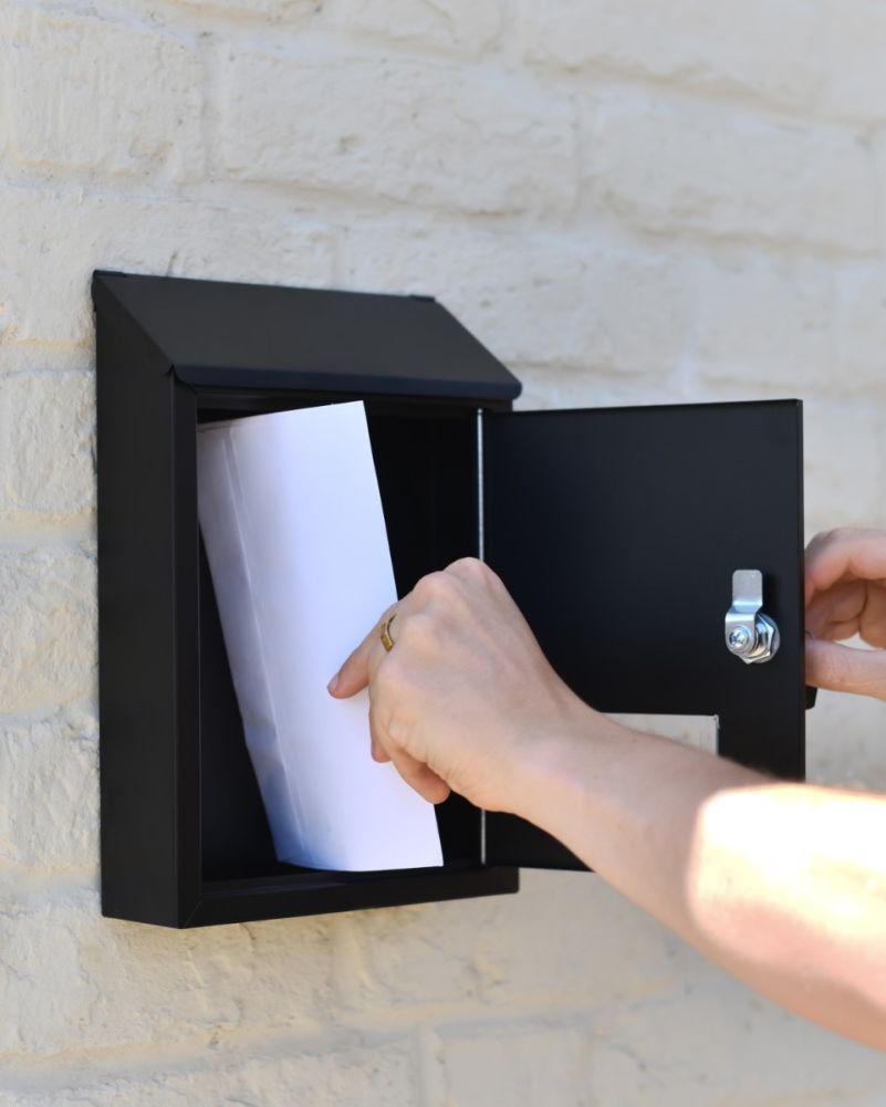 Retrieving Letters From Steel Wall Mounted Contemporary Slanted Post Box In Black