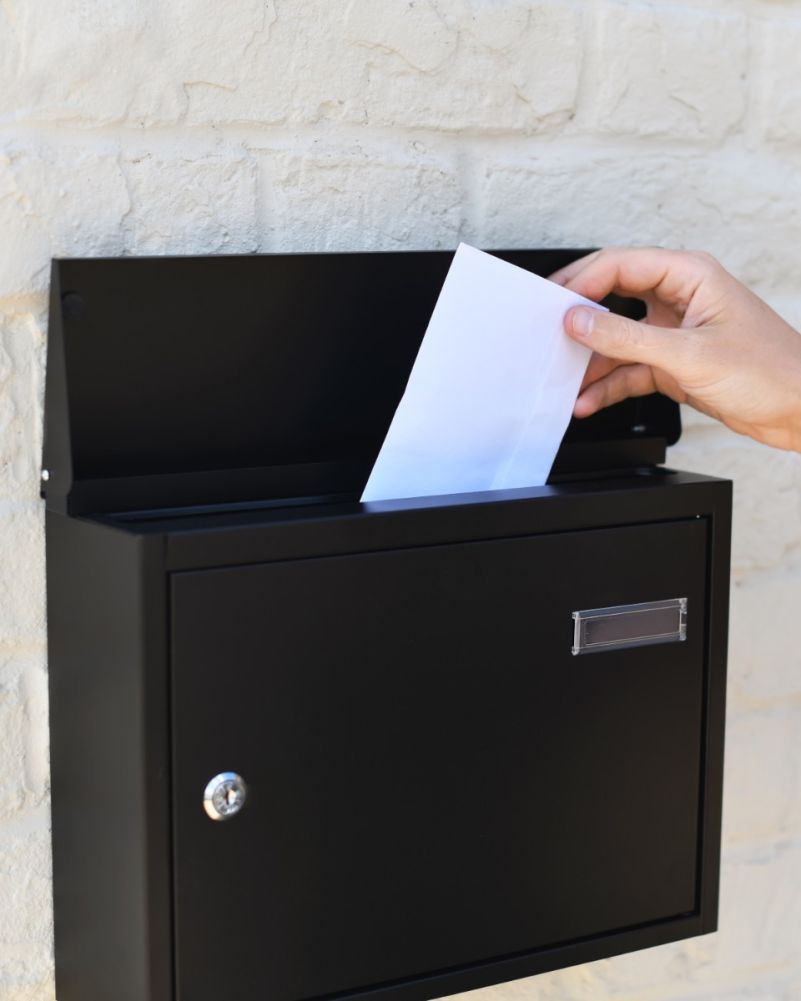 Putting Letters Into Steel Wall Mounted Contemporary Wide Post Box In Black