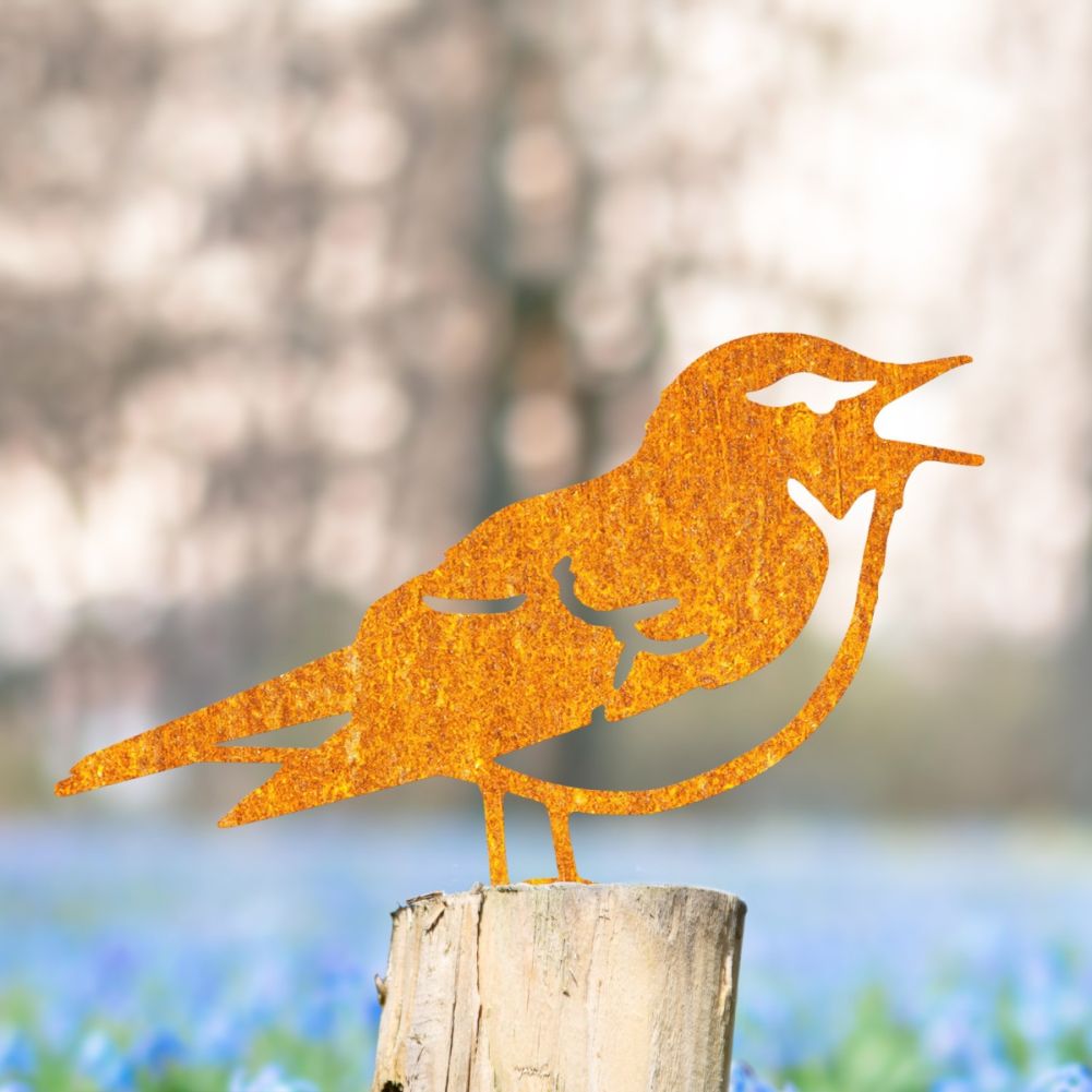 Steel Wood Warbler Fence Topper In Rustic In A Wildflower Setting