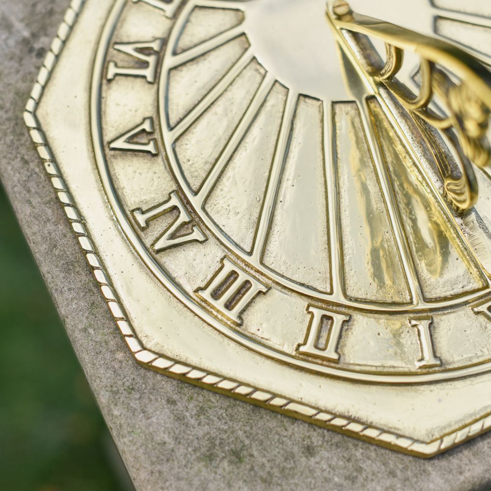 Close Up Of The Numbers From The Tempus Fugit Sundial In Polished Brass