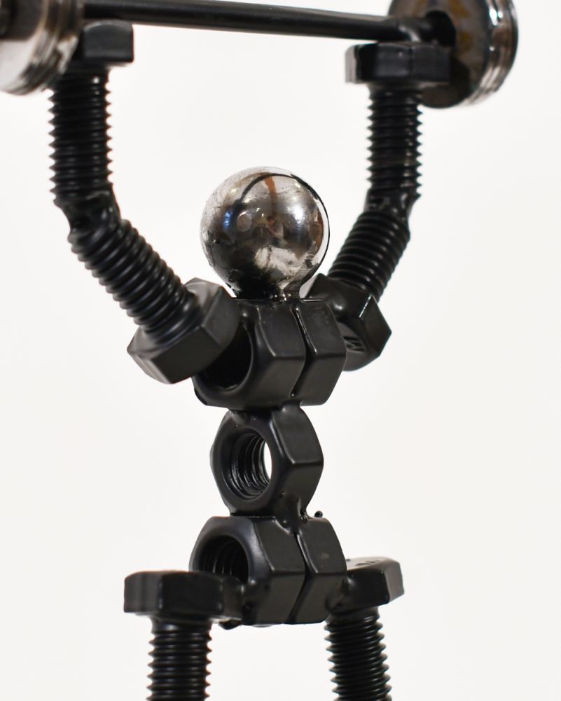 Close Up Of The Over Head Press Scrap Metal Art