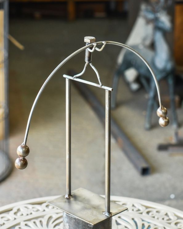 'The Tightrope Walker' Balancing Scrap Metal Art Sculpture Above