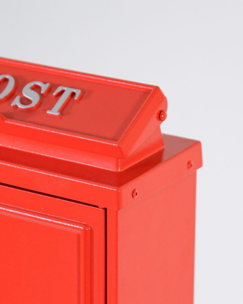 Side Of The Traditional Red Wall Mounted Post Box With Silver Lettering