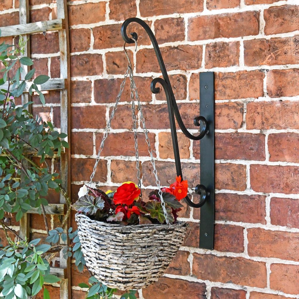 Ornate scroll hanging basket bracket with hanging basket