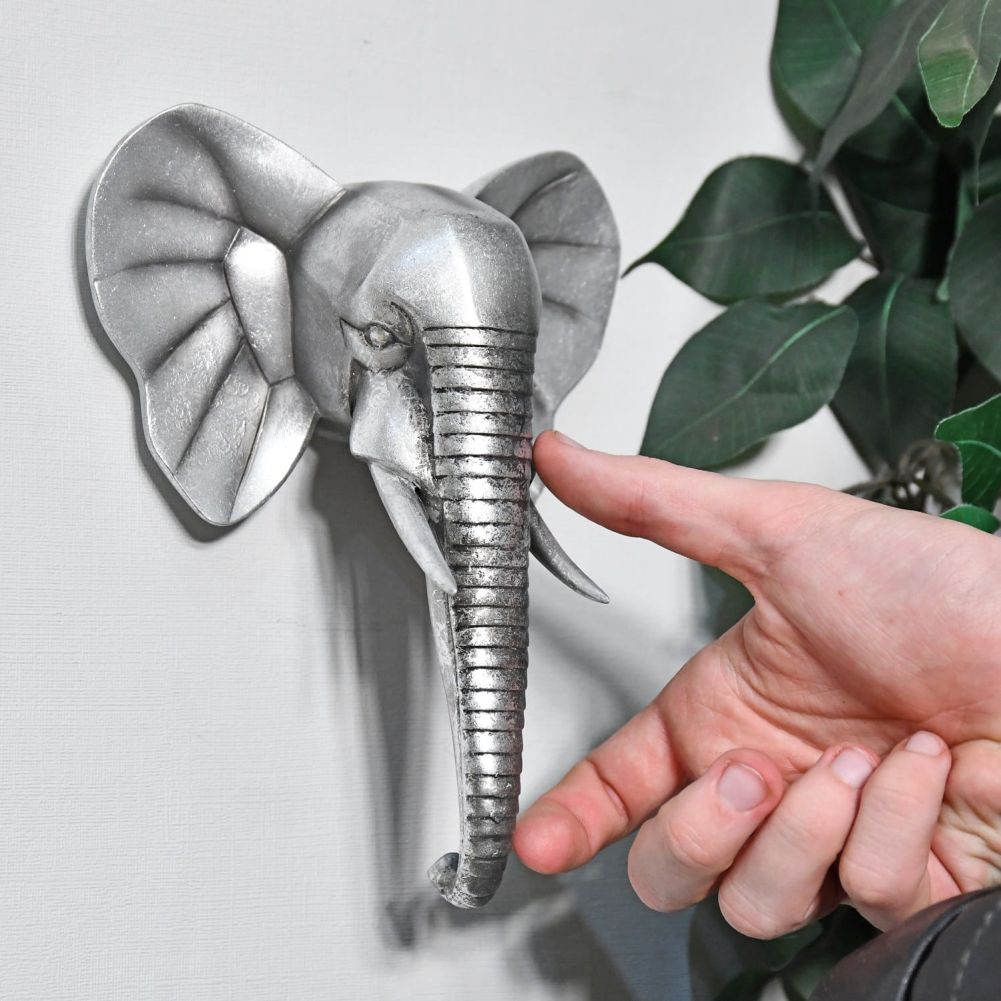 Silver Elephant Wall Art with Hand for Scale 