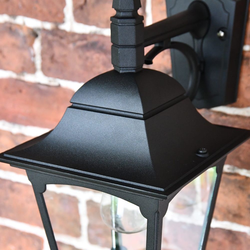 Close up of sleek curved wall lantern top