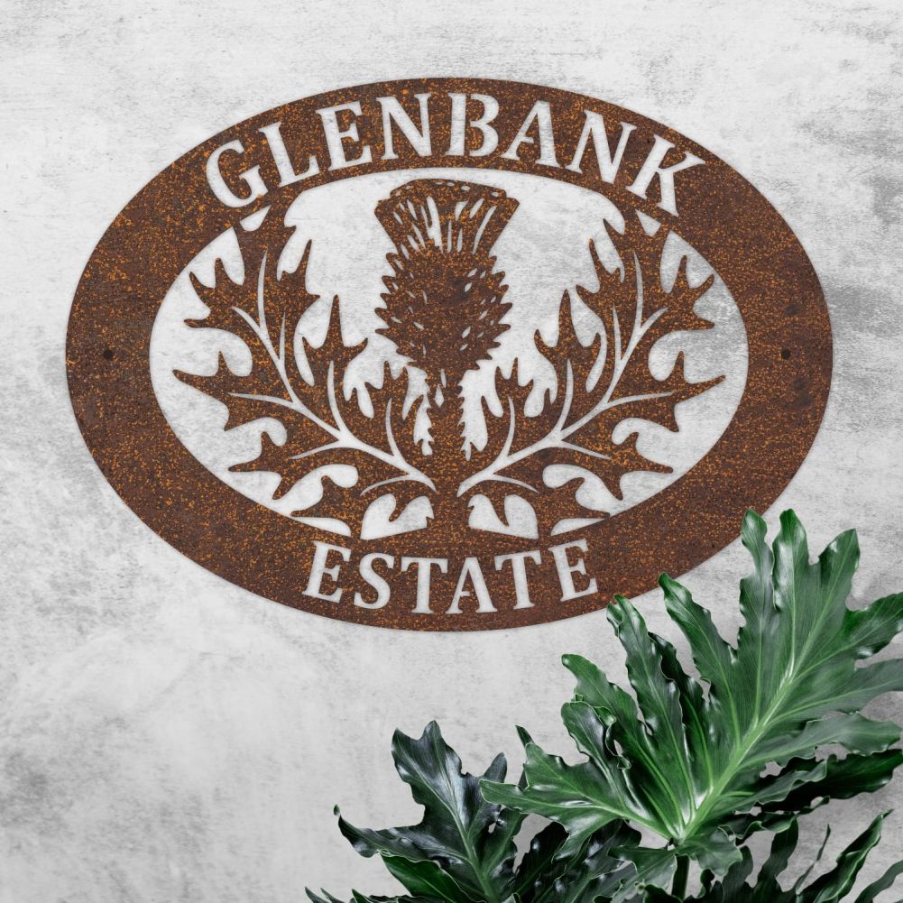 Rustic Thistle Oval House Name Sign On a Rustic Wall