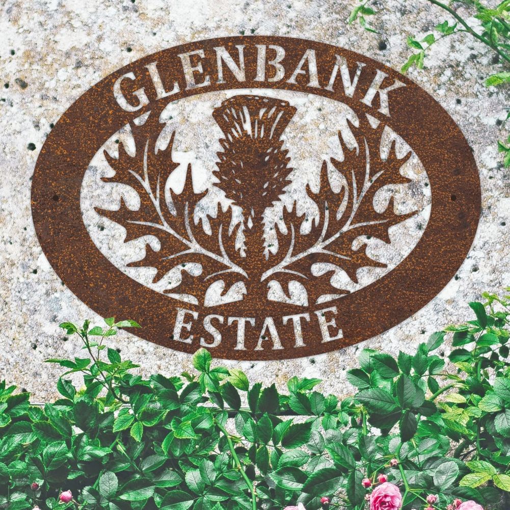 Rustic Thistle Oval House Name Sign On a Granite Wall 