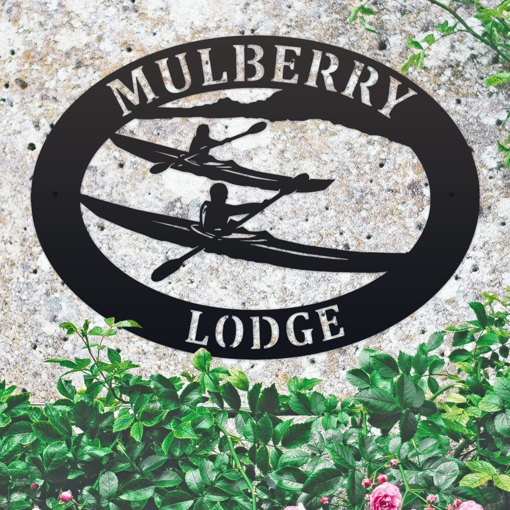 Kayak Oval House Name Sign On a Granite Wall