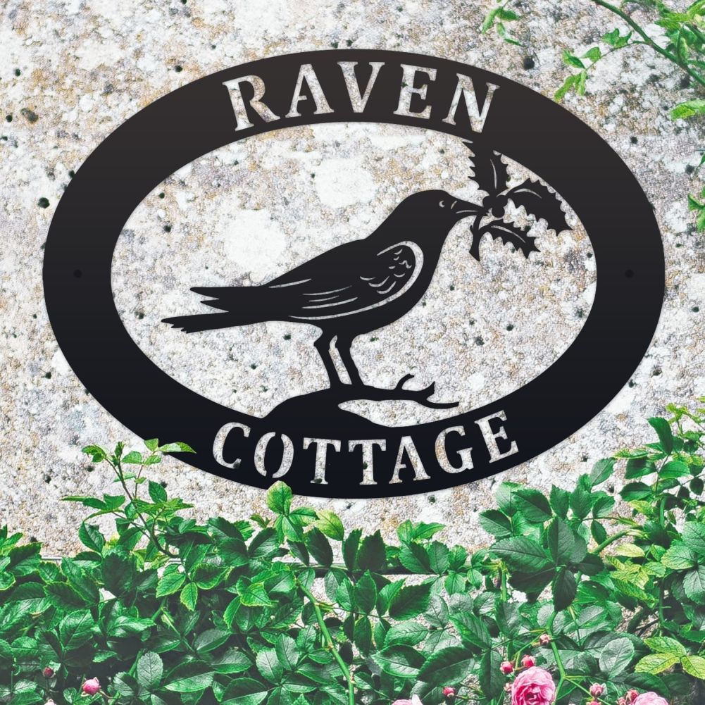 Raven & Holly Oval House Name Sign On a Mottled Wall