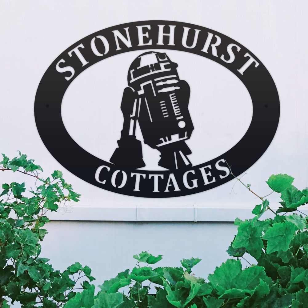 R2D2 Oval House Name Sign On a White Wall