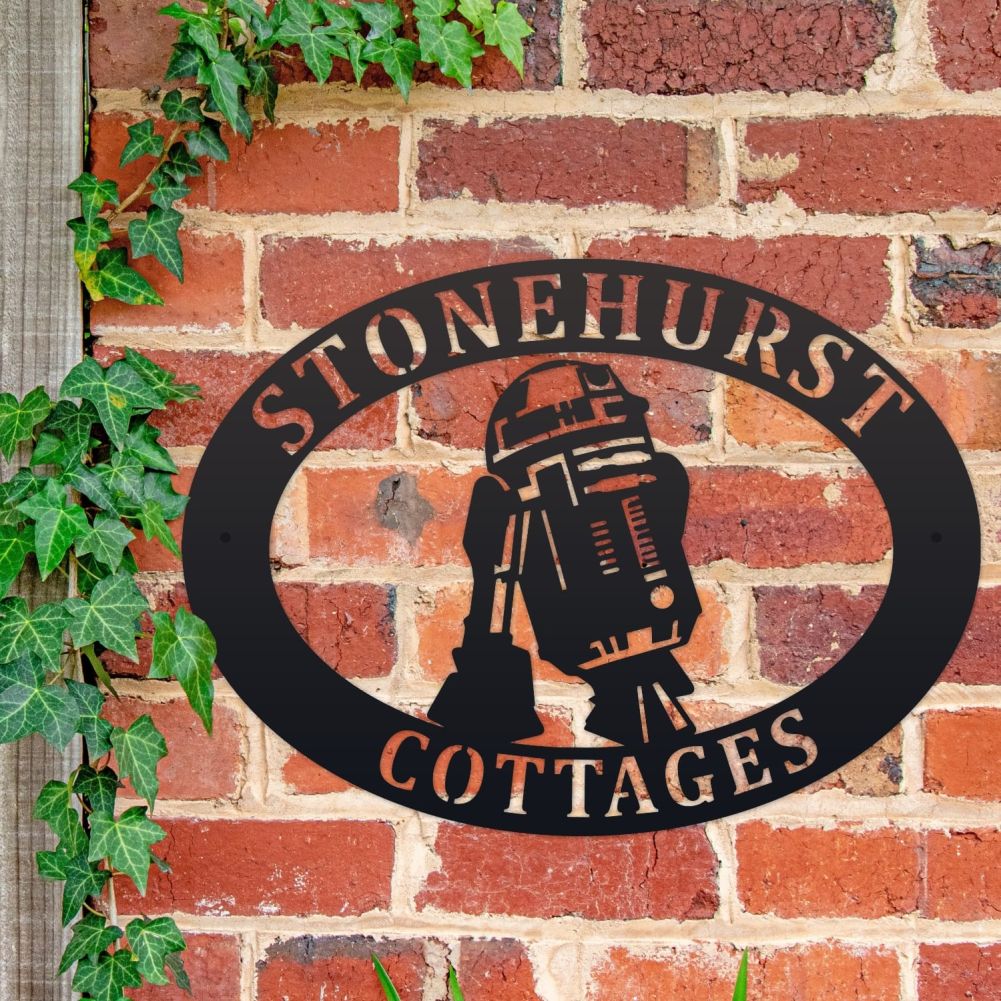 R2D2 Oval House Name Sign On a Brick Wall