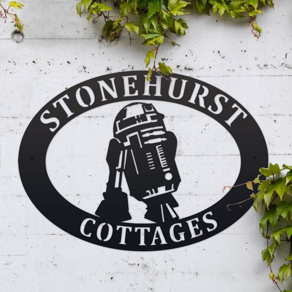 R2D2 Oval House Name Sign On a White Brick Wall