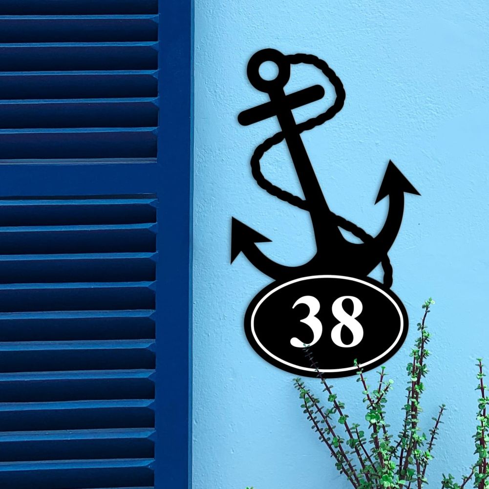 Anchor Iron House Number Sign On a Blue Wall