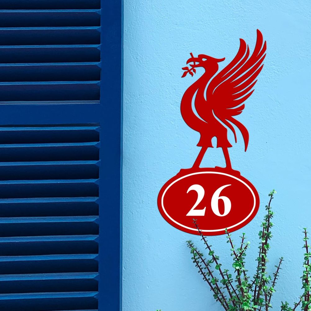 Liver Bird Iron House Number Sign On a Blue Wall