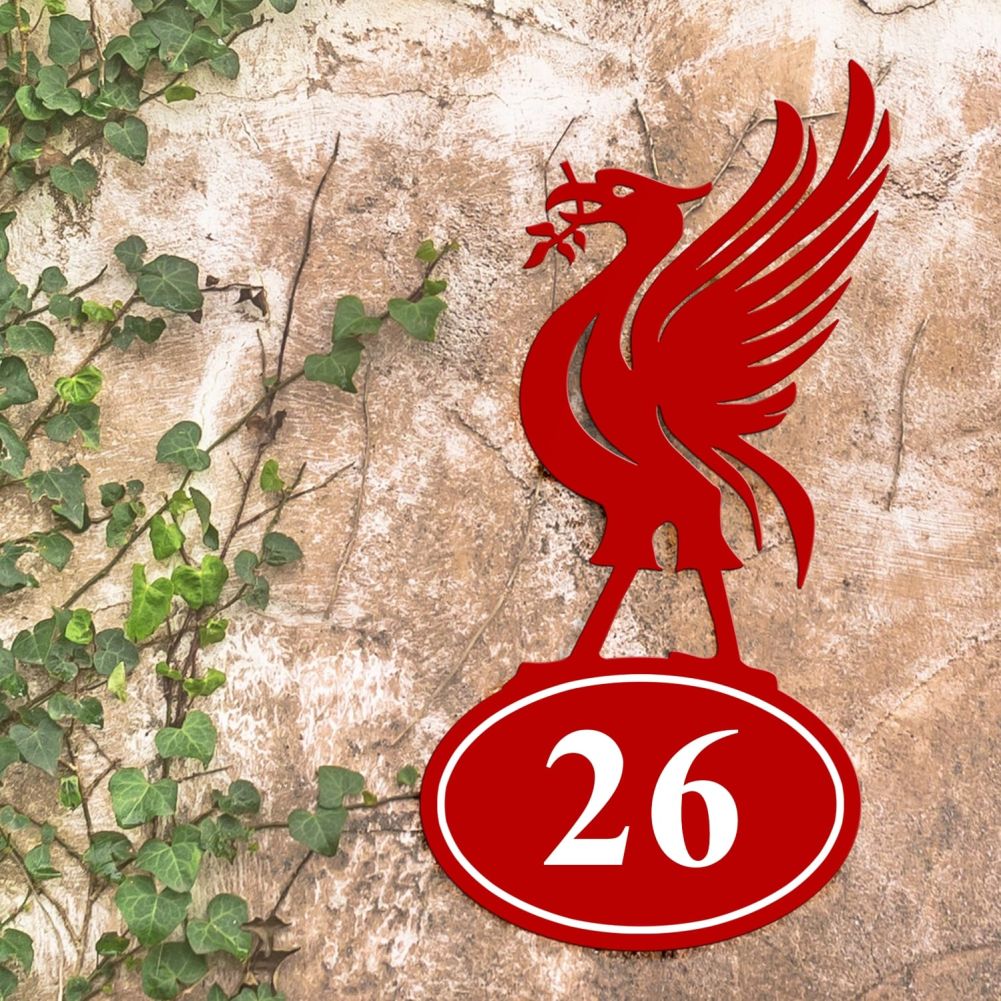 Liver Bird Iron House Number Sign On a Rustic Wall