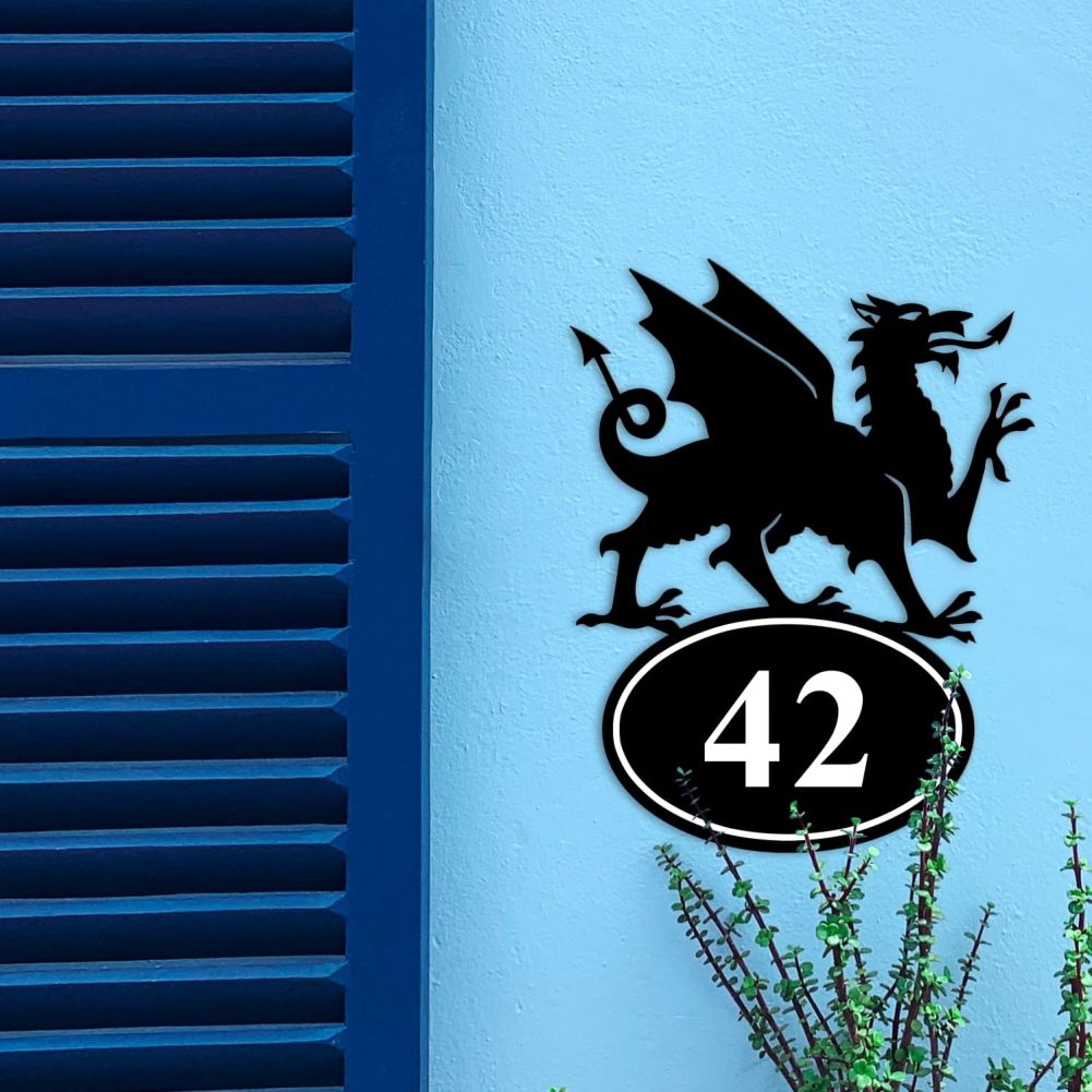 Welsh Dragon Iron House Number Sign On a Blue Wall