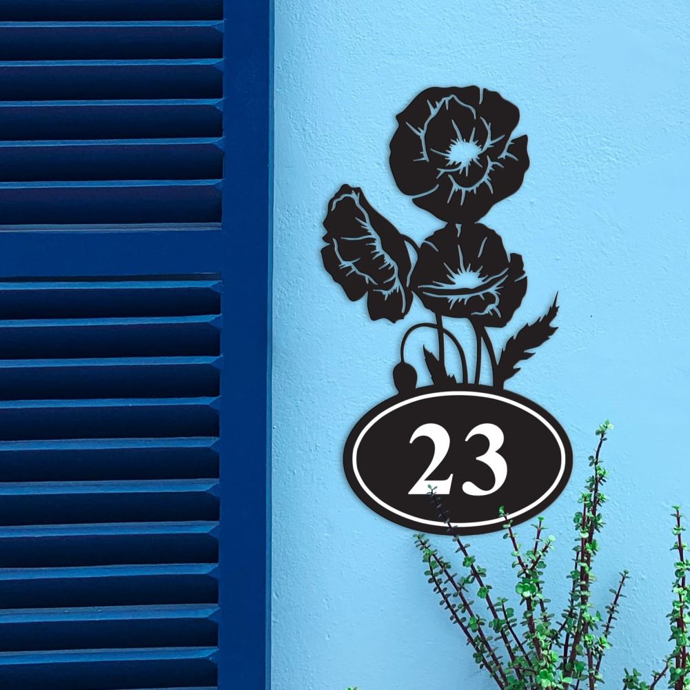 Cluster of Poppies Iron House Number Sign On a Blue Wall