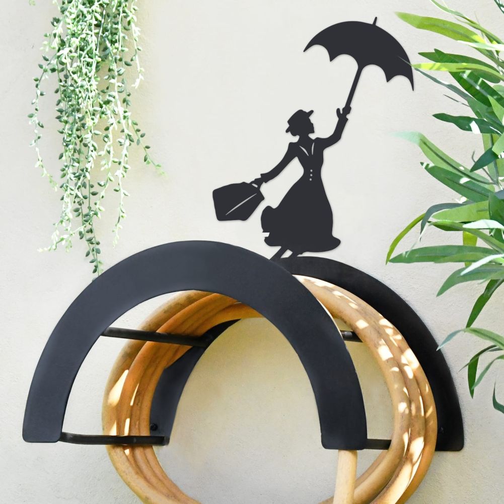 Mary Poppins Hose Holder On a Light Garden Wall
