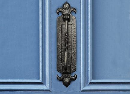 Integrated Cast Iron Door Knocker and Letter Plate on Blue Door