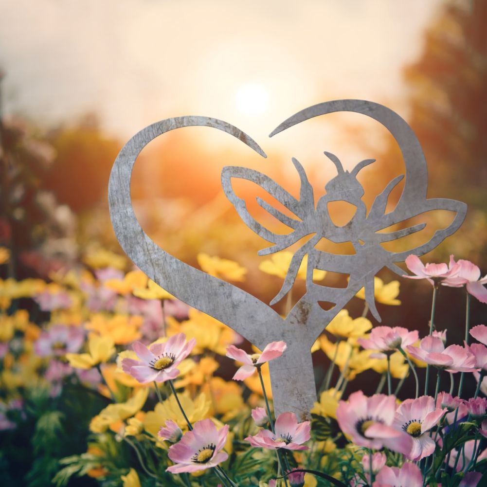 Unfinished Steel Heart & Bee Grave Marker In A Sunny Setting