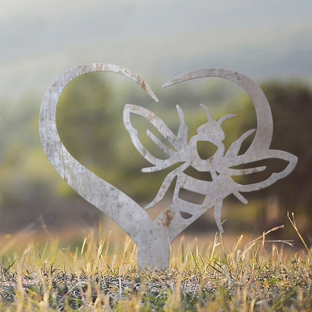 Unfinished Steel Heart & Bee Grave Marker In A Cloudy Setting