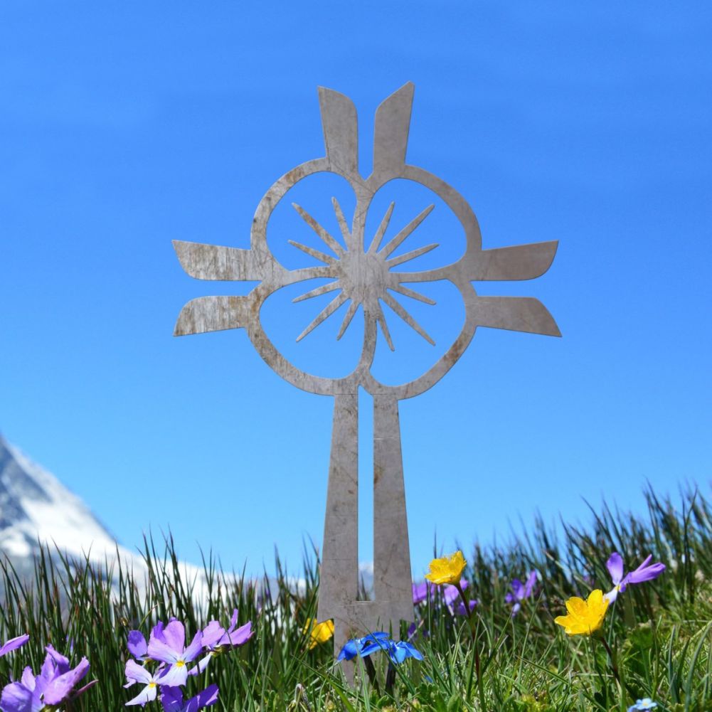 Unfinished Steel Poppy & Cross Ground Spike In A Blue Sky Setting