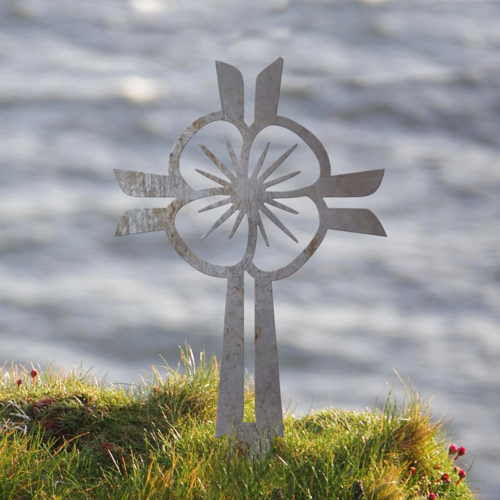 Unfinished Steel Poppy & Cross Ground Spike In A Water Front Setting