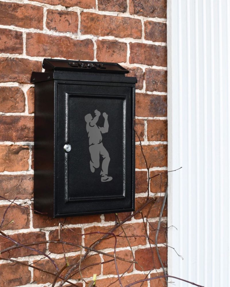 Wall Mounted Post Box With Grey Cricket Bowler Motif On Wall