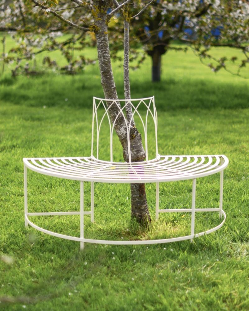 Wrought Iron Chantilly Cream Tree Bench In A Garden Setting