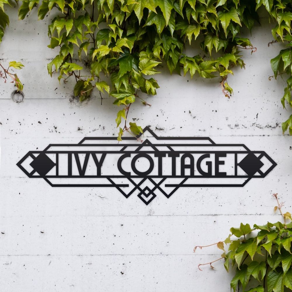 Art Deco House Name Sign On a White Brick Wall