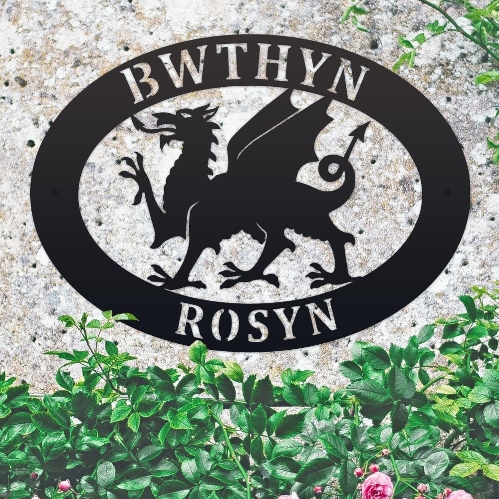 Welsh Dragon Oval House Name Sign On a Mottled Wall
