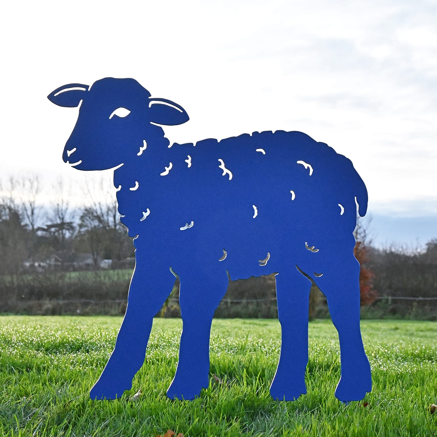 Blue Curly Lamb Iron Silhouette Looking Left