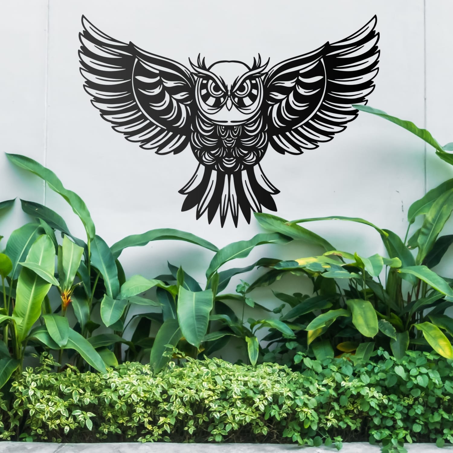 Large Black Owl Wall Art On an Outside Wall