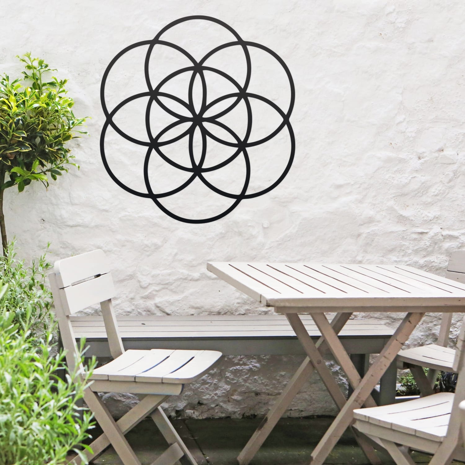 Black "Seed of Life" Steel Wall Art With Garden Furniture