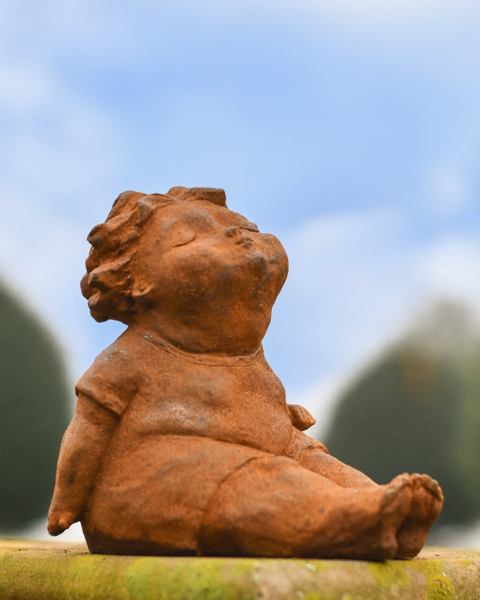 Rustic Cast Iron Sitting Child Garden Sculpture