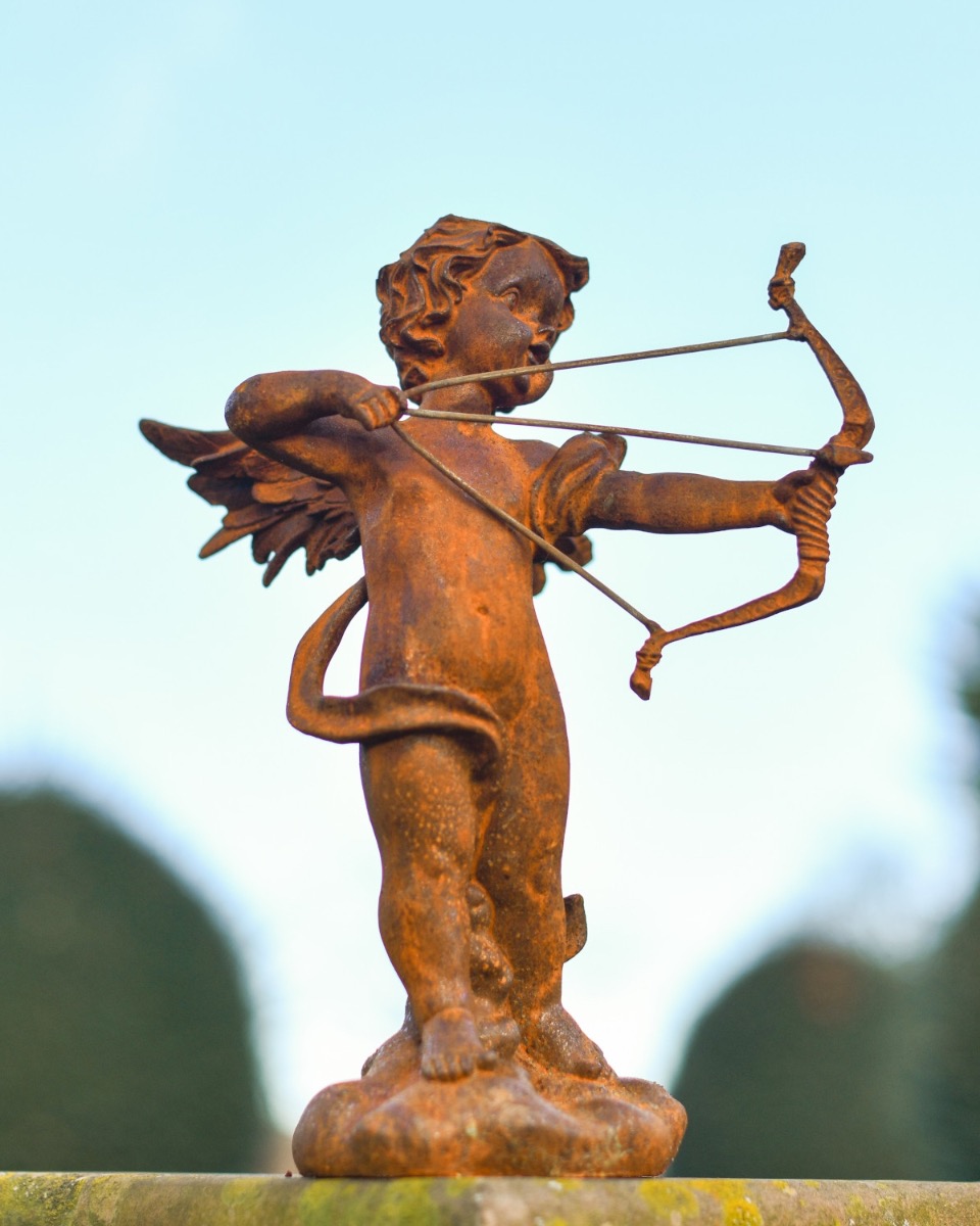 Rustic Cast Iron Cupid Sculpture