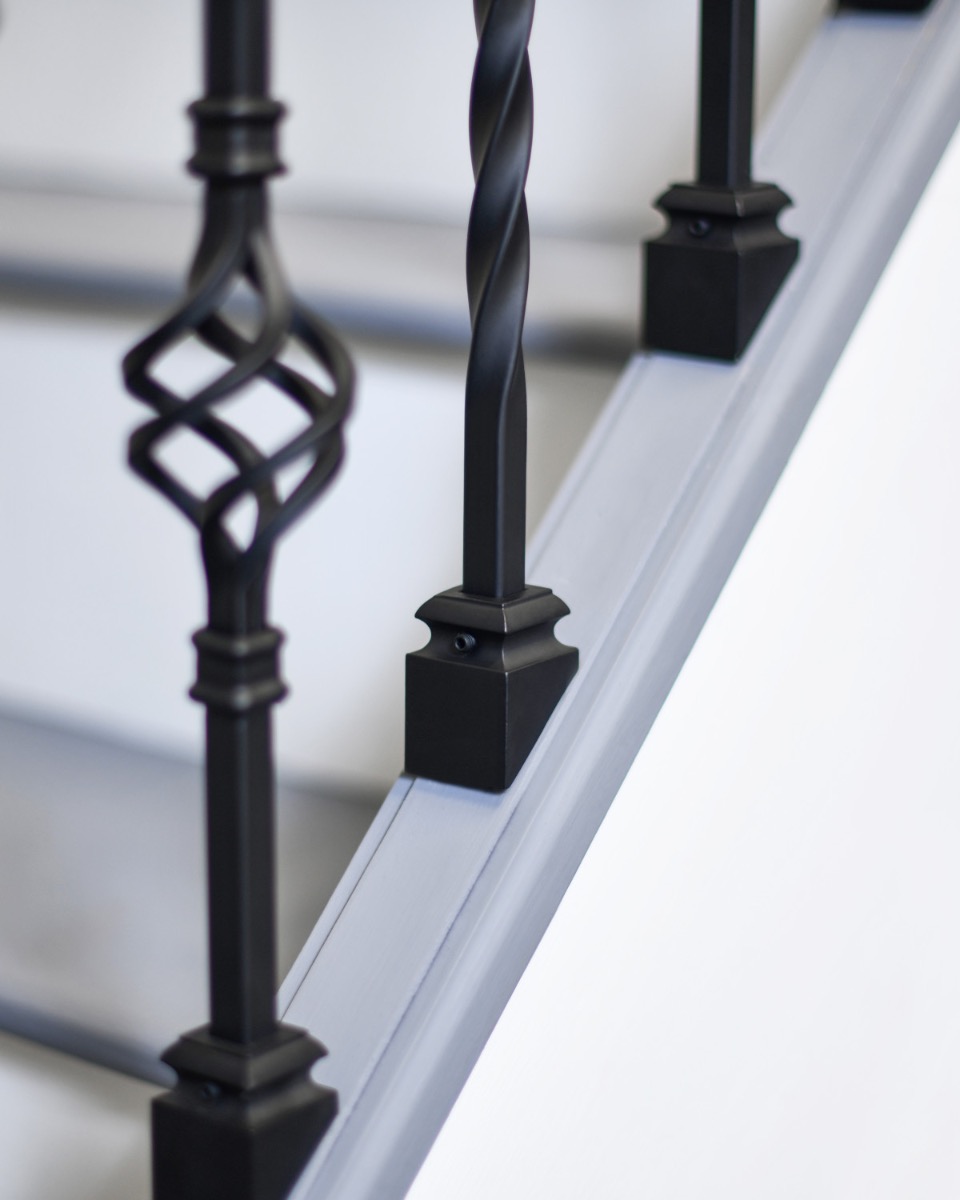 Close up of Set of 2 Steel "Lindley & Albury" Stair Spindles in Matte Black (Pattern 6) Fixed Brackets