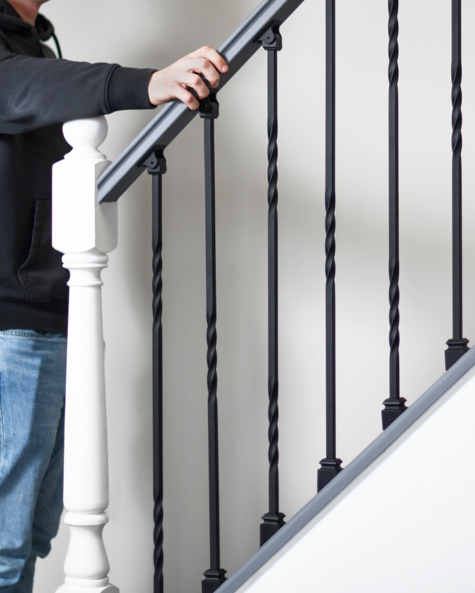 Scale Shot Of Set of 2 Steel "Redbridge & Trinity" Stair Spindles in Matte Black (Pattern 4)