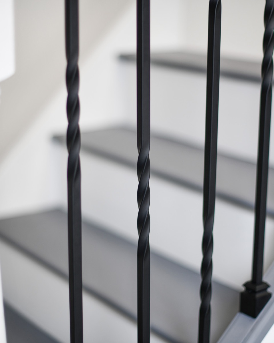 Close Up Of Set of 2 Steel "Redbridge & Trinity" Stair Spindles in Matte Black (Pattern 4) Twists