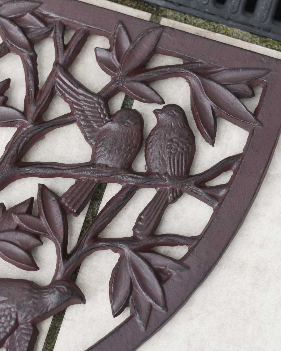 Close up of Cast Iron "Charlton" Ornate Half Moon Door Mat in Rustic Bird Detailing