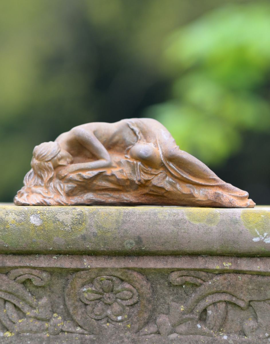 Rustic Cast Iron Woman Sleeping On The Rock