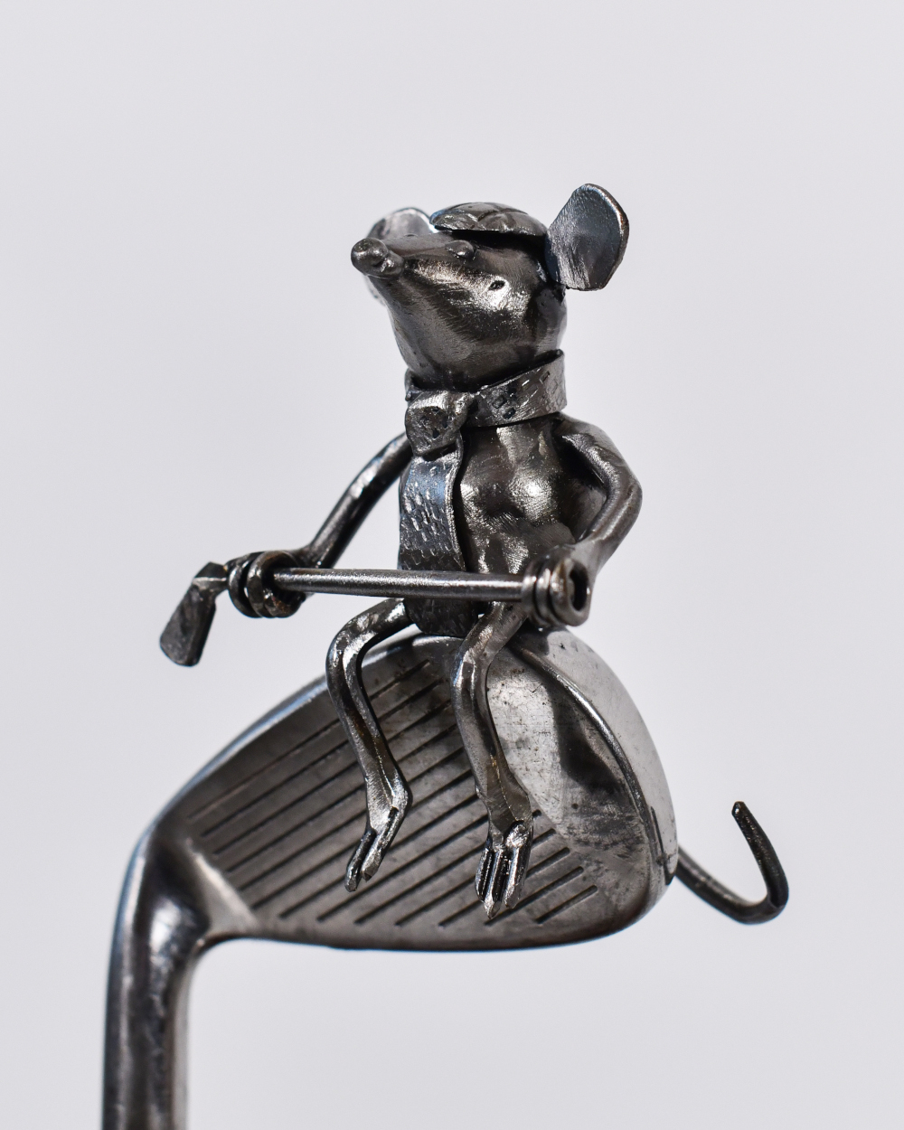 Close Up Of The Mouse Home Ornament On A Wooden Base