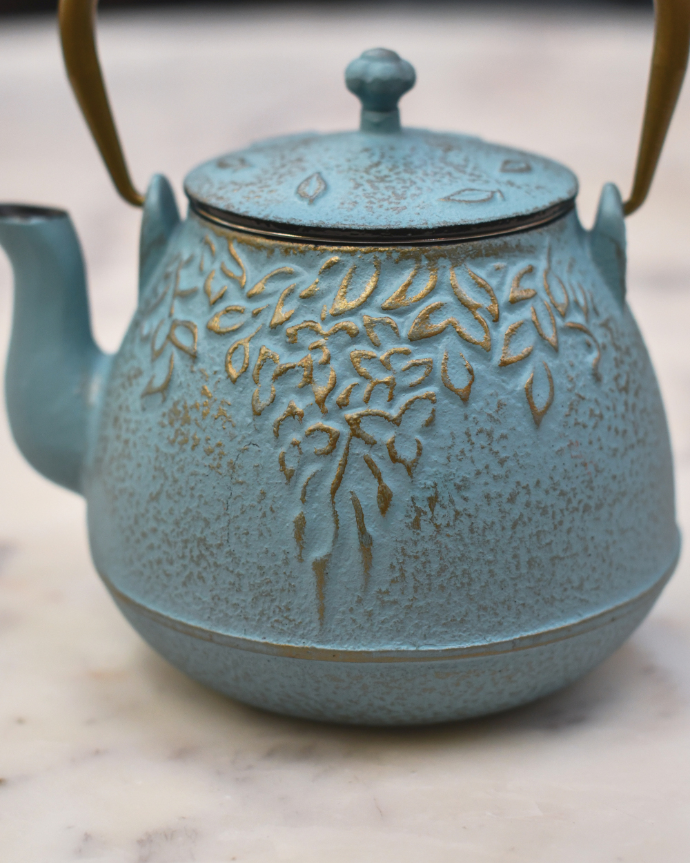 Close Up Of The Details From The Ornate Cast Iron Japanese Teapot